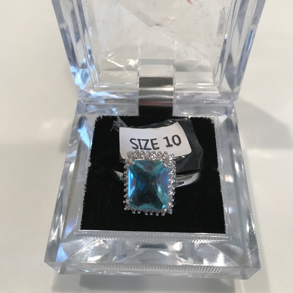 Ring. Size 10. CZ Aquamarine surrounded by CZ's